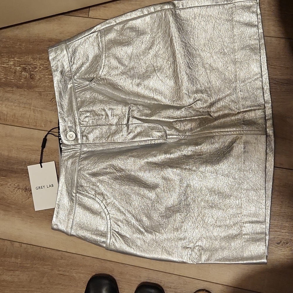 Silver mini skirt size med brand new